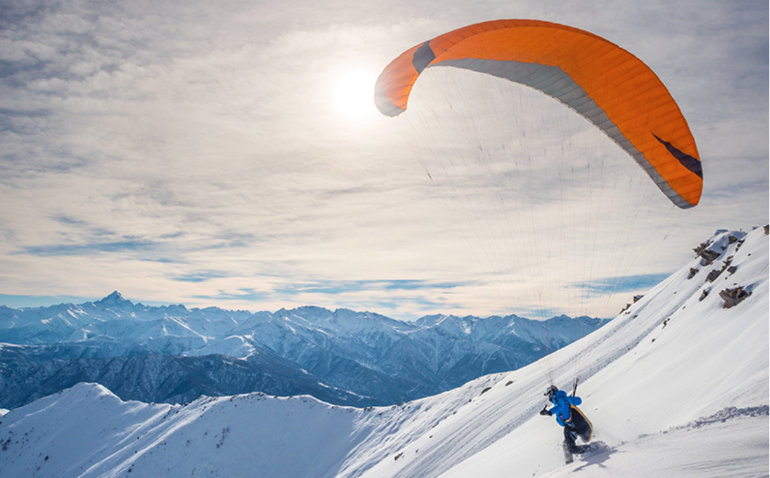 Paraglider on mountain top