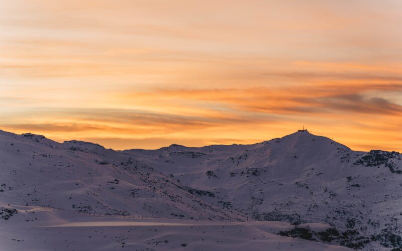 Sunset over the snowy peaks in Val Thorens, France