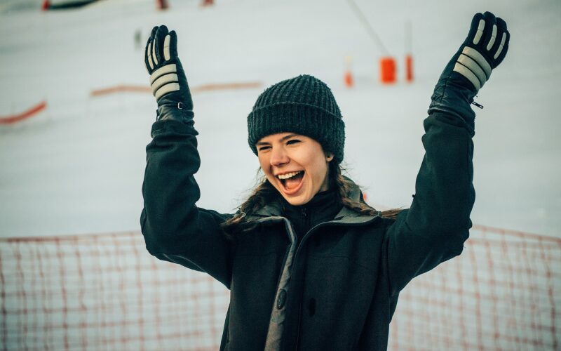 A woman grinning on the slopes in Avoriaz