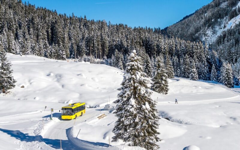 A ski bus travelling between ski resorts in Austria through the snow